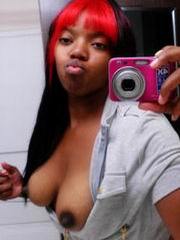 Redhead ebony chick showing tits on..