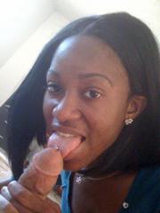 Portrait of a randy ebony girl sucking cock and